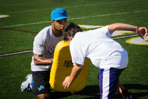 Portrait of Golden Tate coaching at the Golden Tate Football Camp